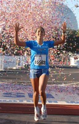 Gabriela Trana, of Costa Rica, celebrates after winning the women's division of the Walt Disney World Marathon in Lake Buena Vista, Fla., Sunday, Jan.